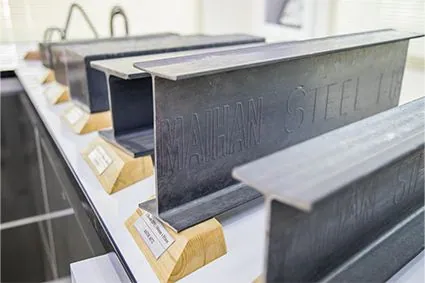 Maihan Steel beams on display, embossed with the MAIHAN STEEL mark